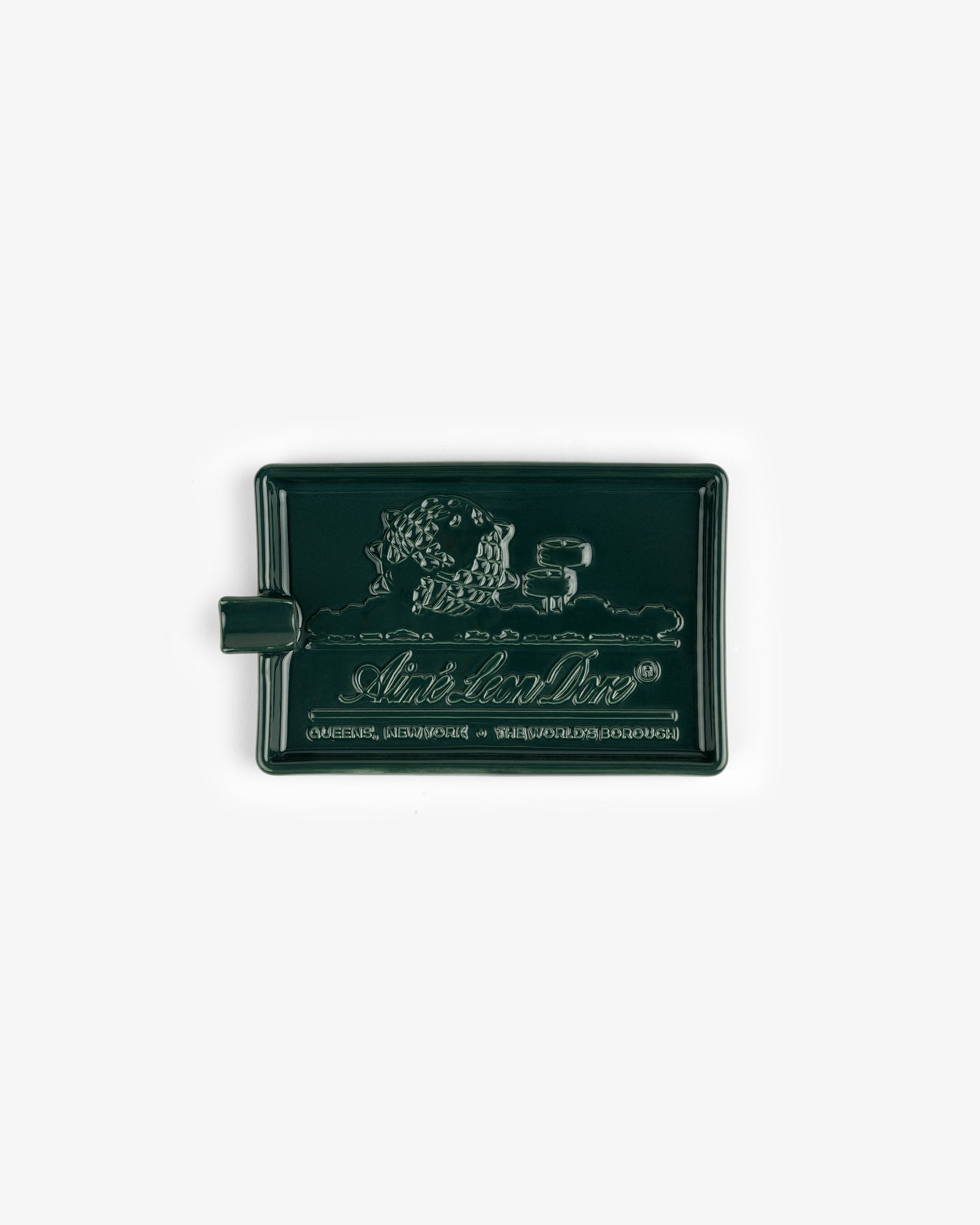 Dark green Ceramic Unisphere Ashtray, rectangular shape with embossed lion and text, plus a small side handle.