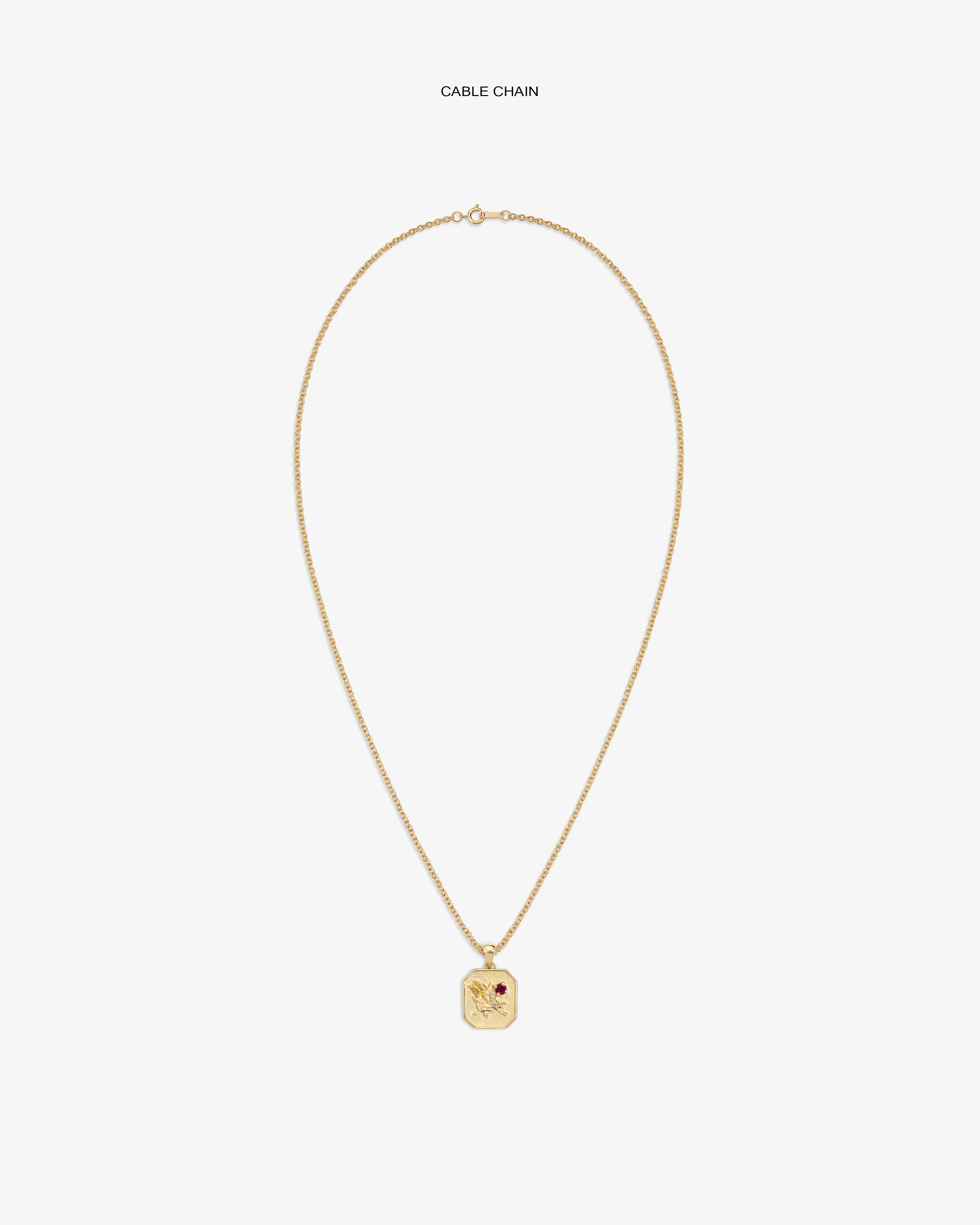 14Kt Gold Queens Crest Relief Pendant on a cable chain, featuring an engraved crest and a small red gemstone accent.