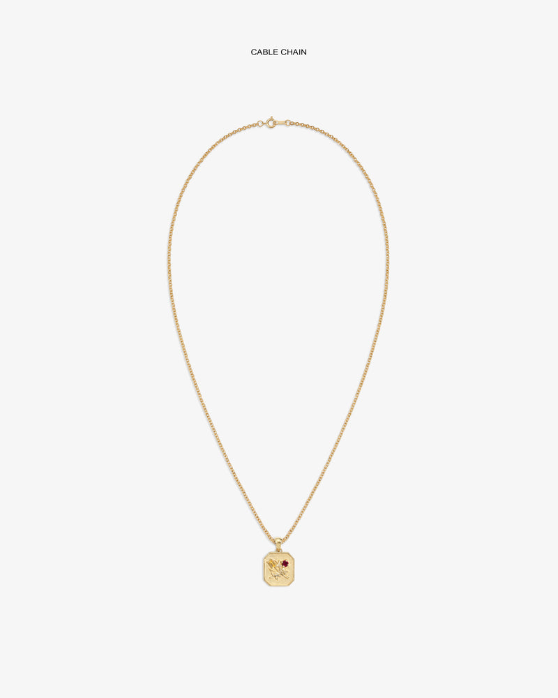 14Kt Gold Queens Crest Relief Pendant on a cable chain, featuring an engraved crest and a small red gemstone accent.