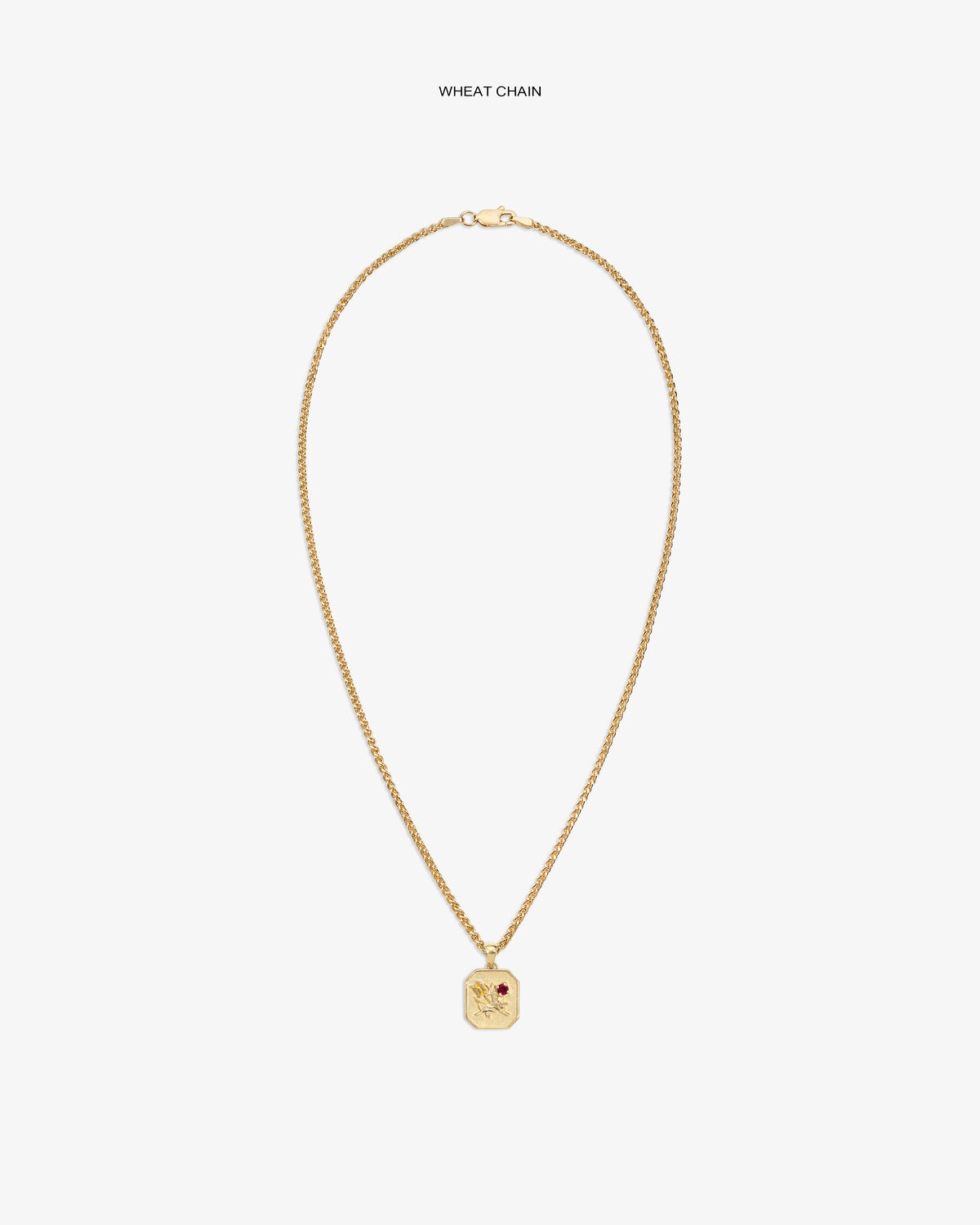 14Kt Gold Queens Crest Relief Pendant with wheat chain and red stone, displayed on a white background.