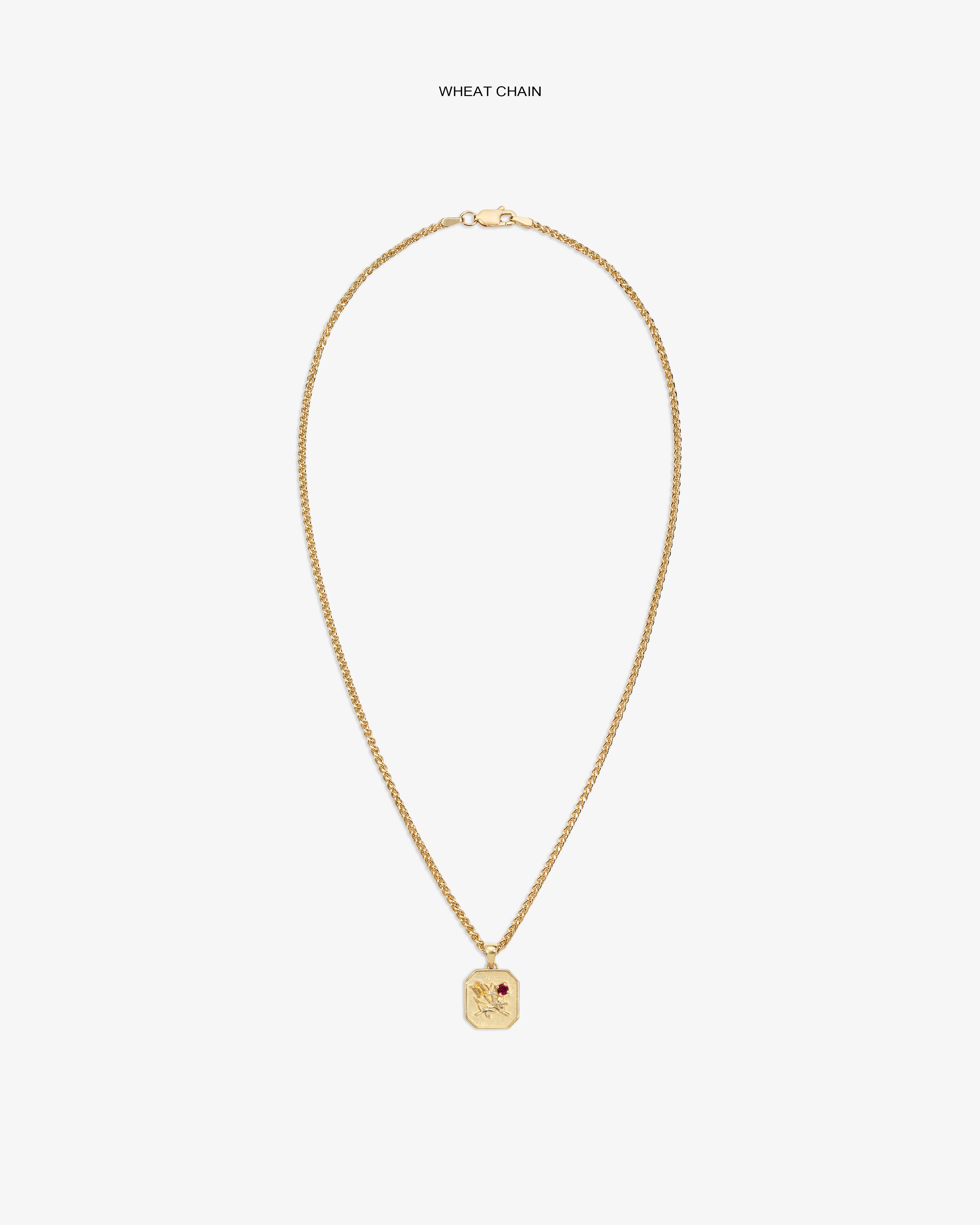 14Kt Gold Queens Crest Relief Pendant with wheat chain and red stone, displayed on a white background.
