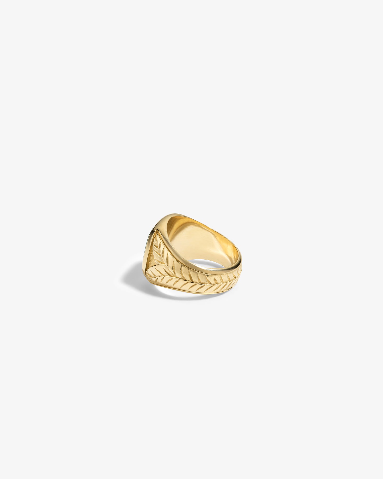 14Kt Gold Jade Signet Ring featuring a wide band with engraved leaf or feather patterns on a white background.