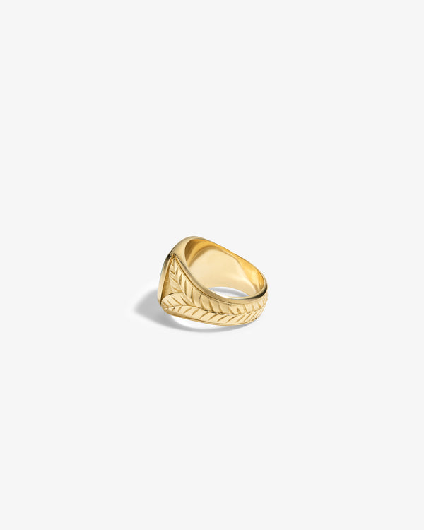 14Kt Gold Jade Signet Ring featuring a wide band with engraved leaf or feather patterns on a white background.