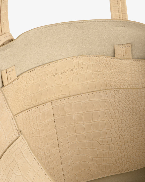 Close-up of the beige Croc-Embossed Nubuck Tote Bag, with "Handmade in Italy" stamped inside.