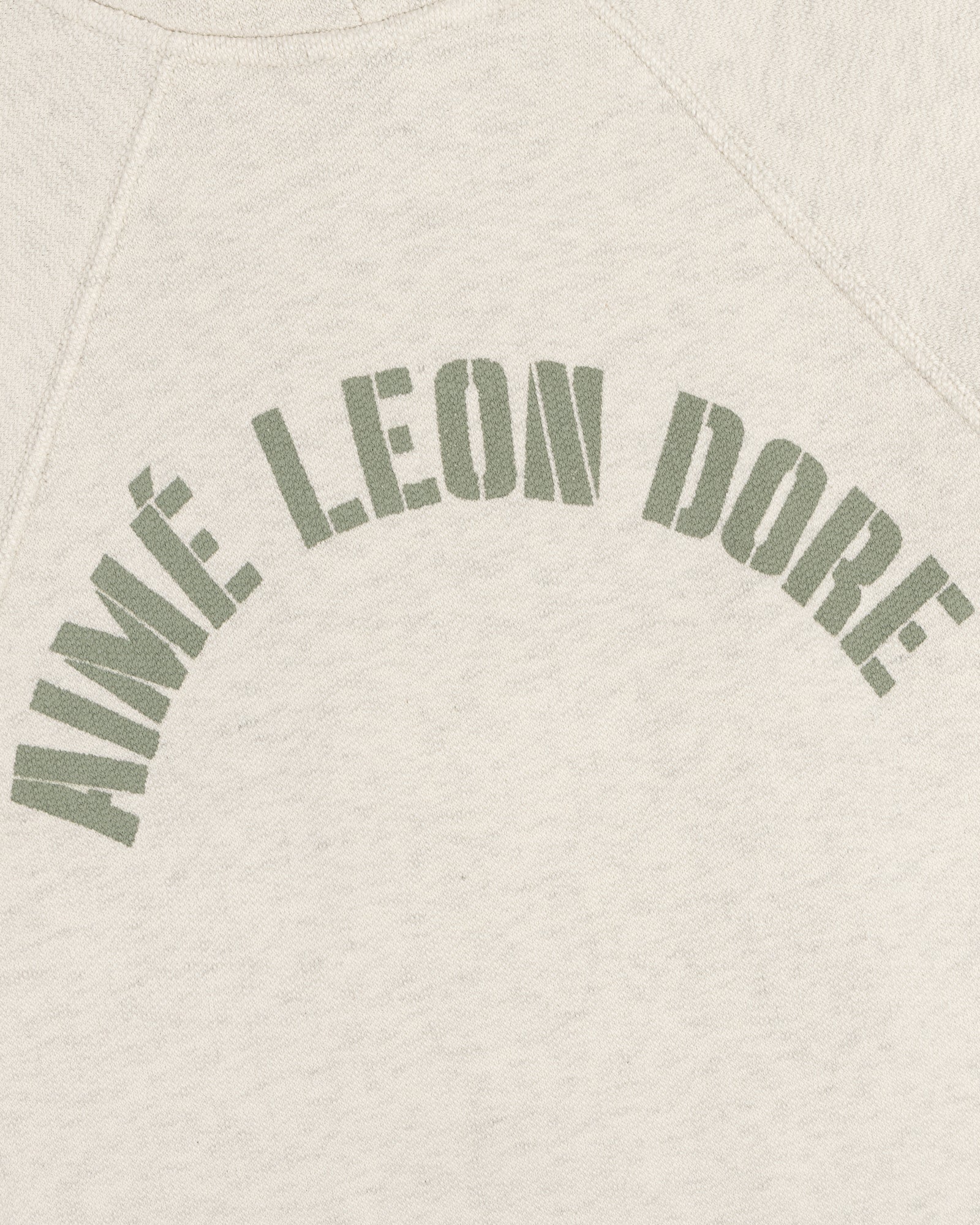 Cream Dock Hoodie with AIMÉ LEON DORE in bold, olive green, arched block letters across the chest.