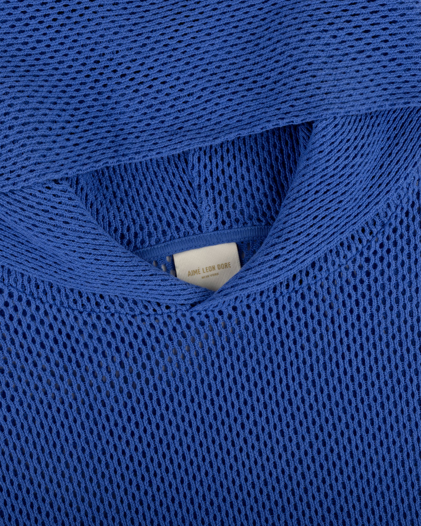 Close-up of a blue Open Mesh Hoodie highlighting the neckline and interior label detail.