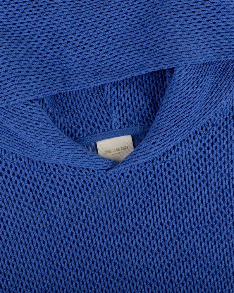 Close-up of a blue Open Mesh Hoodie highlighting the neckline and interior label detail.