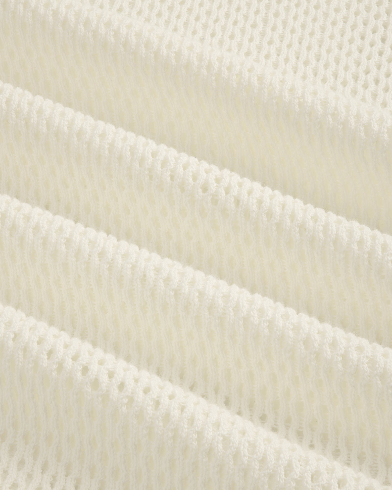 Close-up of the white Open Mesh Hoodie featuring a knitted, ribbed texture in horizontal folds.