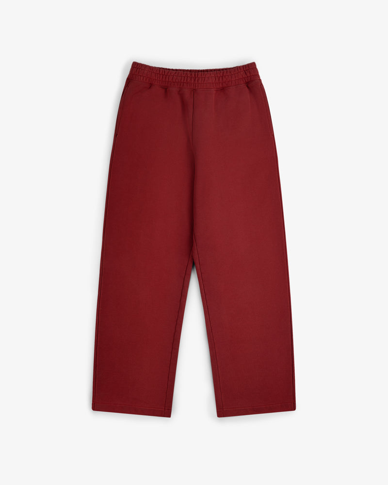Flat lay of Sun Faded Sweatpants, loose-fit and high-waisted with an elastic waistband, on a white background.