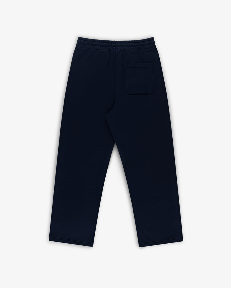 Crest Sweatpants in navy blue with an elastic waistband and single back pocket, laid flat on a white background.