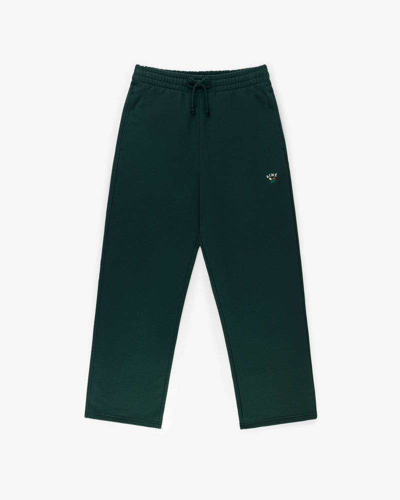 Crest Sweatpants in dark green with elastic waistband, drawstring, pockets, and a small left thigh logo.