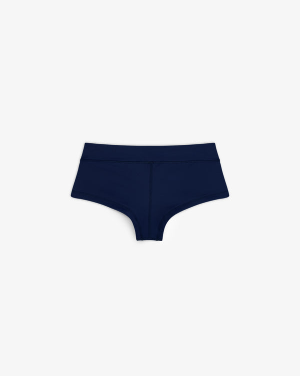 Crest Swim Short in dark blue for women, boyshort style, shown on a plain white background.