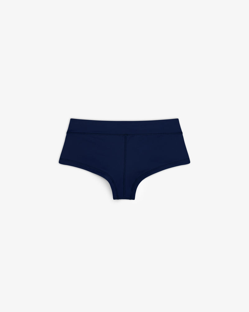 Crest Swim Short in dark blue for women, boyshort style, shown on a plain white background.