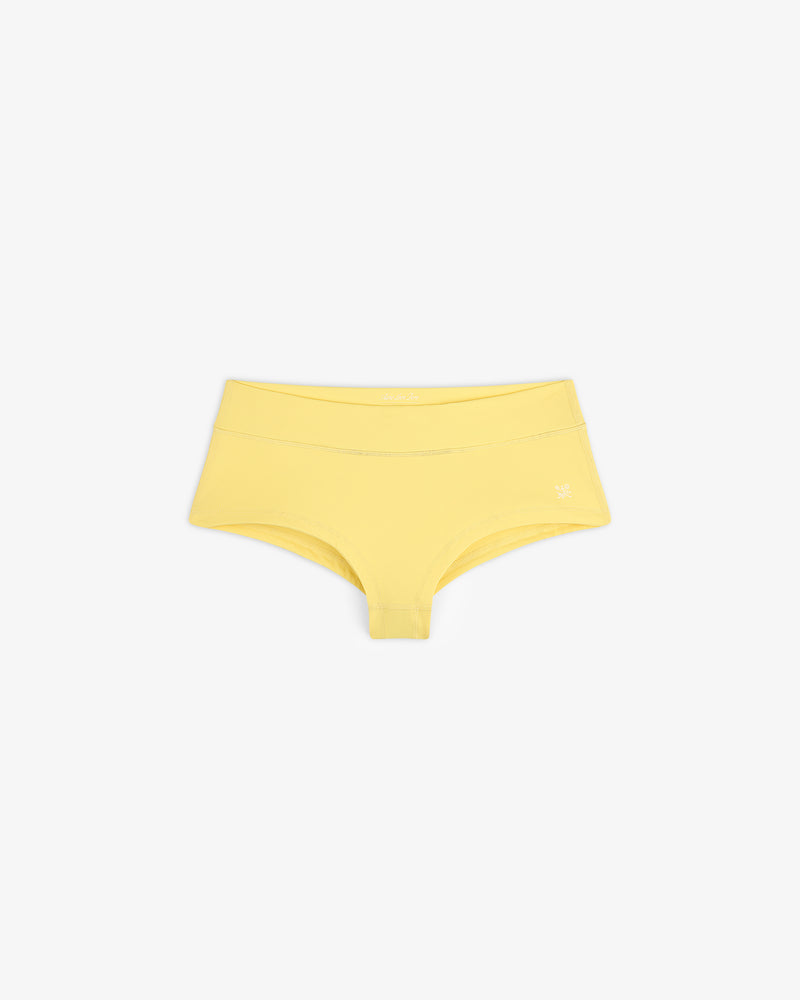 Yellow Crest Swim Short for women laid flat on a white background.
