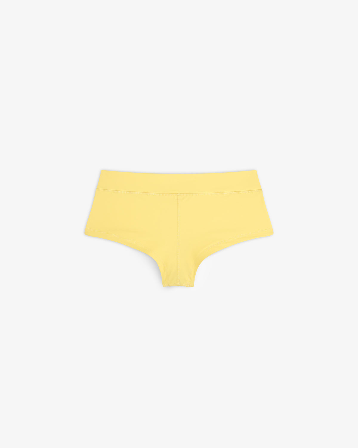 Crest Swim Short in yellow for women displayed on a white background.