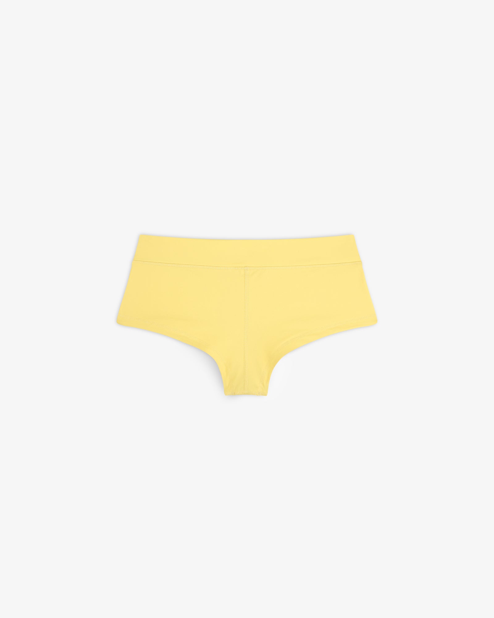 Crest Swim Short in yellow for women displayed on a white background.