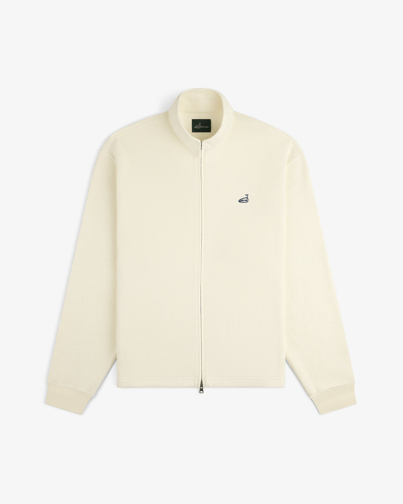 ALD Golf Piqué Full Zip Sweater in cream with a small navy logo on the left chest, shown on white background.