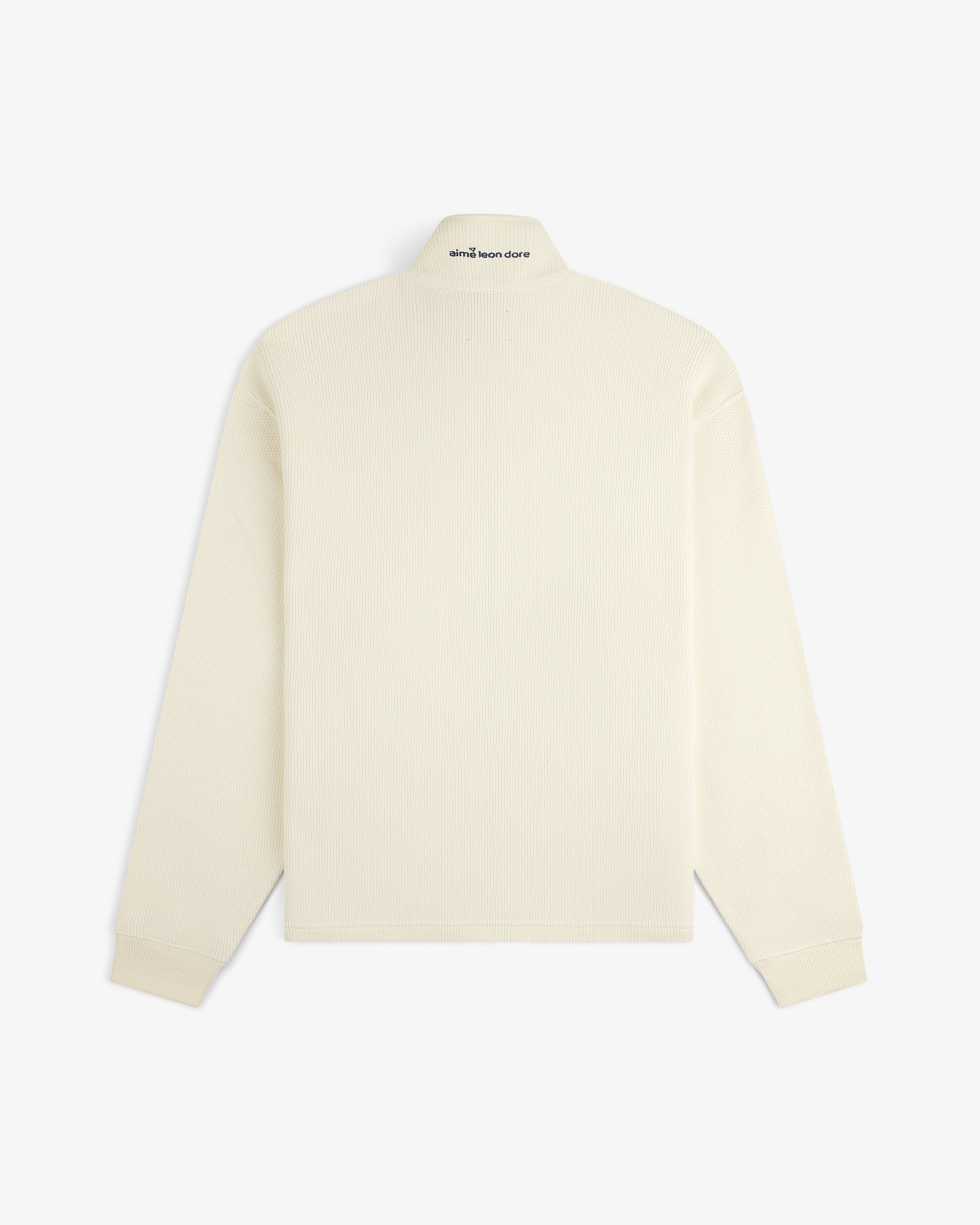 Back of the ALD Golf Piqué Full Zip Sweater, long-sleeve, off-white with subtle black collar text.