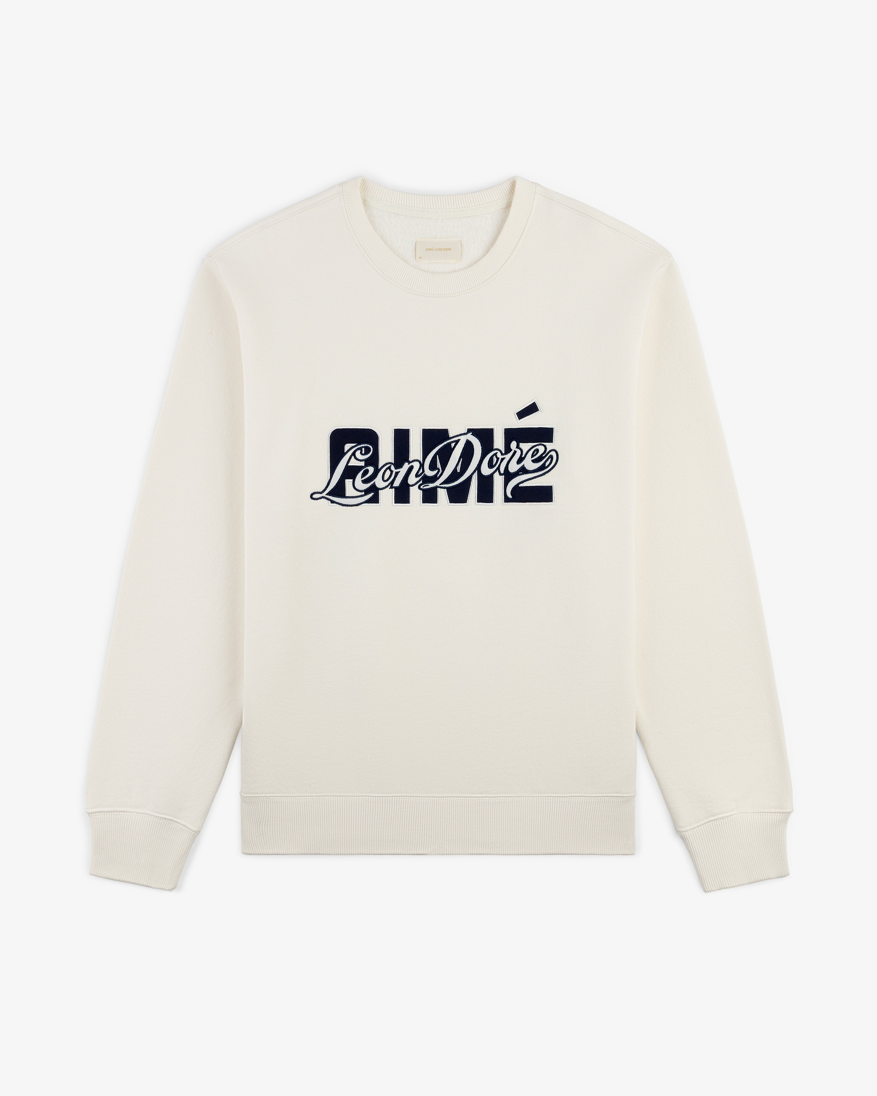 Cream Overlay Logo Crewneck Sweatshirt featuring a bold navy Aimé Leon Dore logo across the chest.