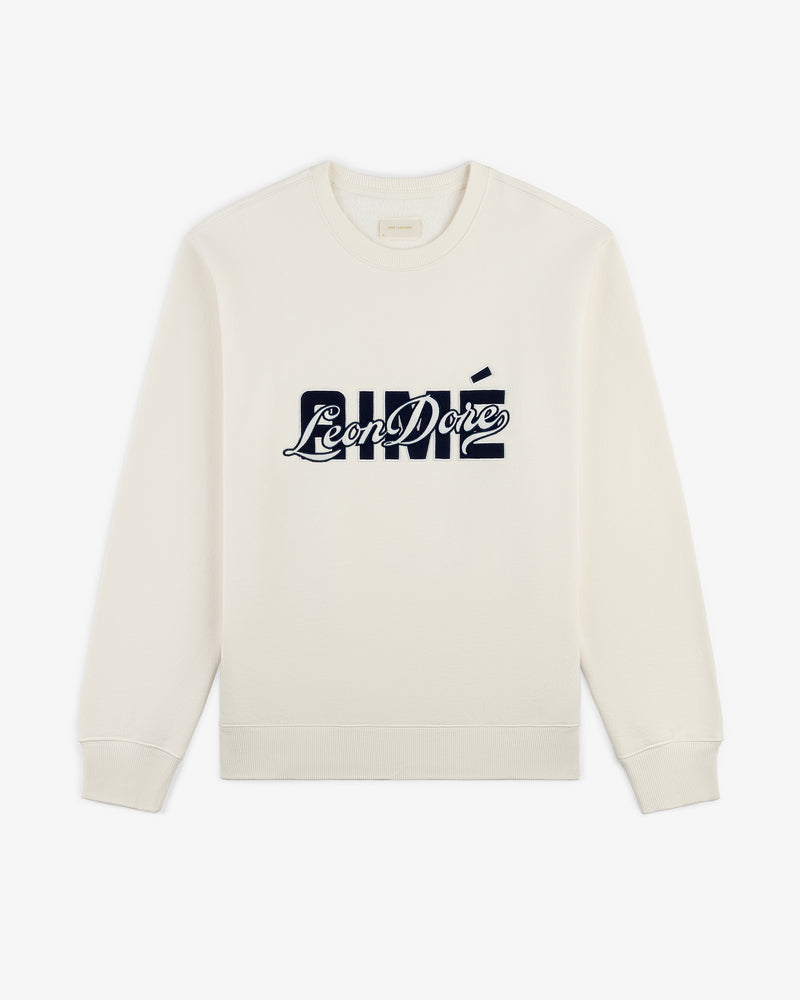Cream Overlay Logo Crewneck Sweatshirt featuring a bold navy Aimé Leon Dore logo across the chest.