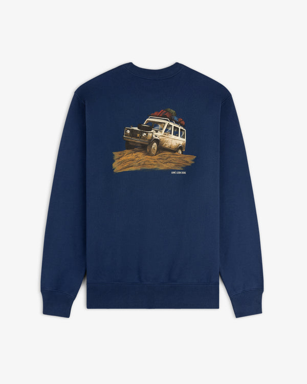 Safari Crewneck Sweatshirt in navy blue featuring an off-road vehicle illustration with rooftop supplies on a dirt path.