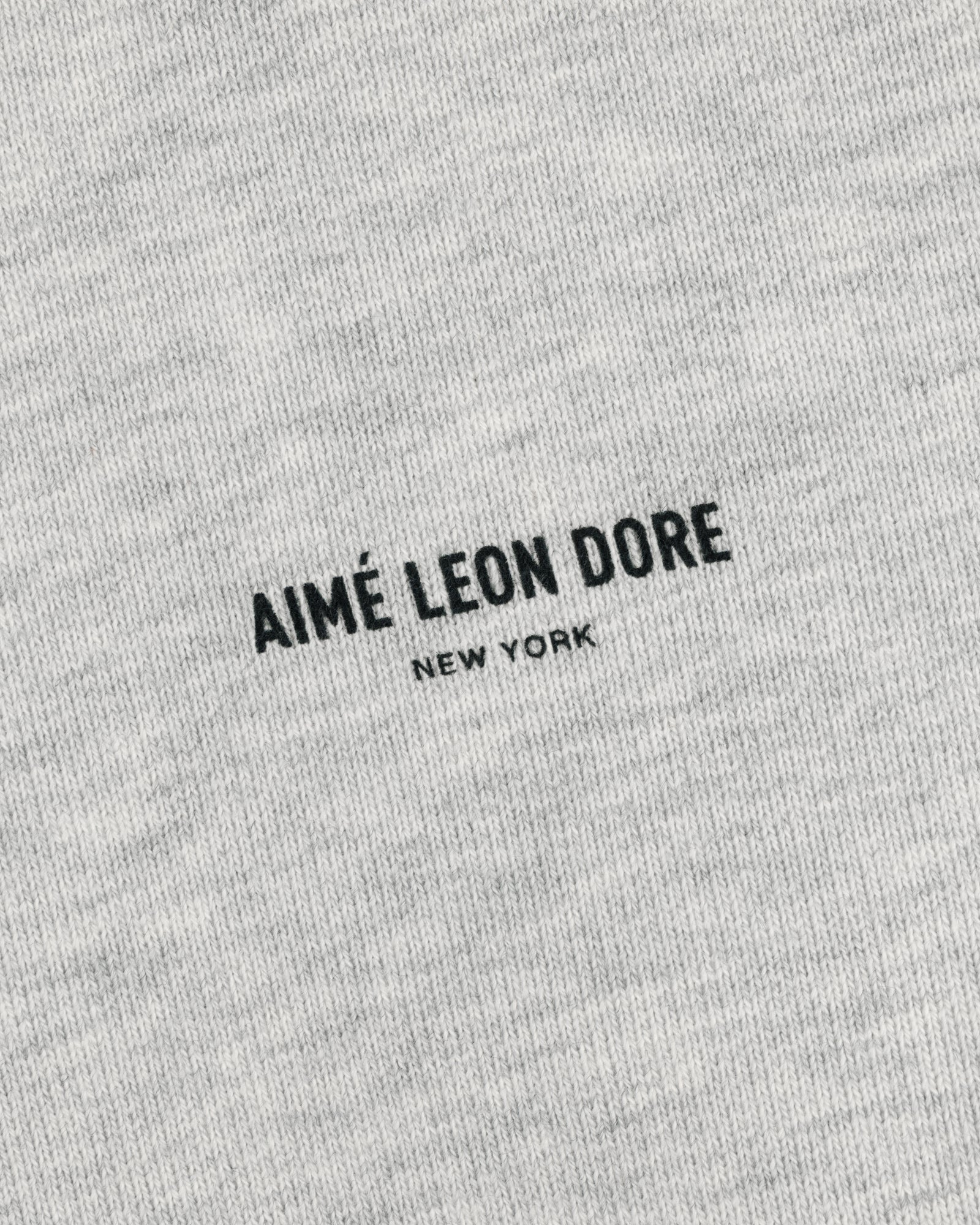 Gray Safari Crewneck Sweatshirt with minimalist centered "AIMÉ LEON DORE NEW YORK" in black text.
