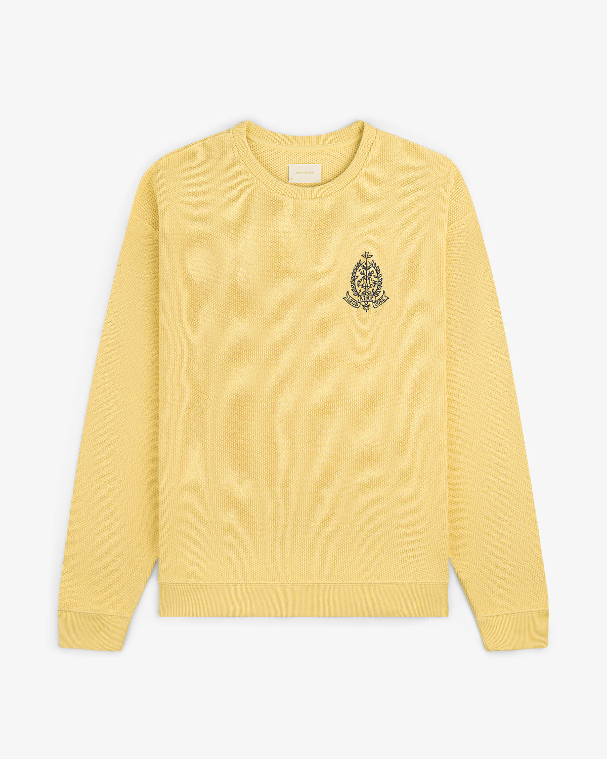 Saint George Piqué Crewneck Sweatshirt in yellow with small black crest on left chest, displayed on white background.