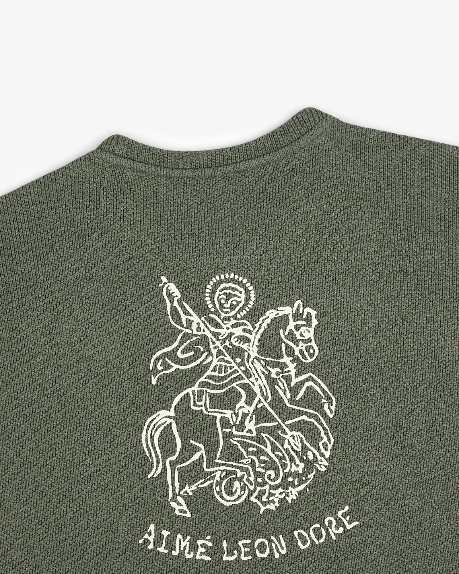 Green textured Saint George Piqué Crewneck Sweatshirt with a white knight graphic above AIMÉ LEON DORE text.