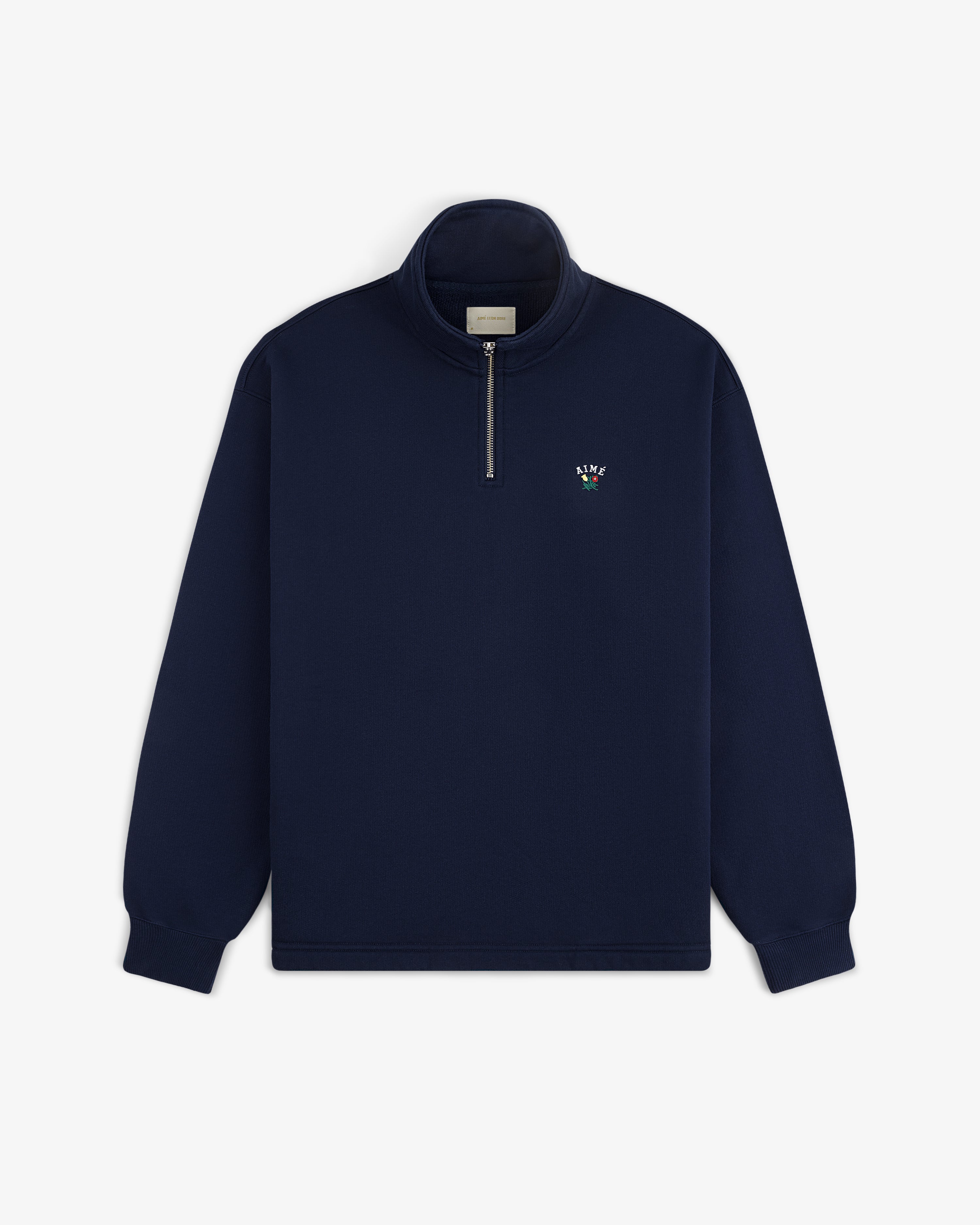Crest Quarter Zip Pullover: Navy blue, long sleeves, left chest features a small embroidered logo.