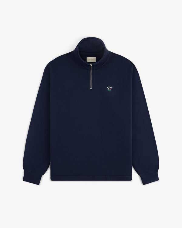 Crest Quarter Zip Pullover: Navy blue, long sleeves, left chest features a small embroidered logo.