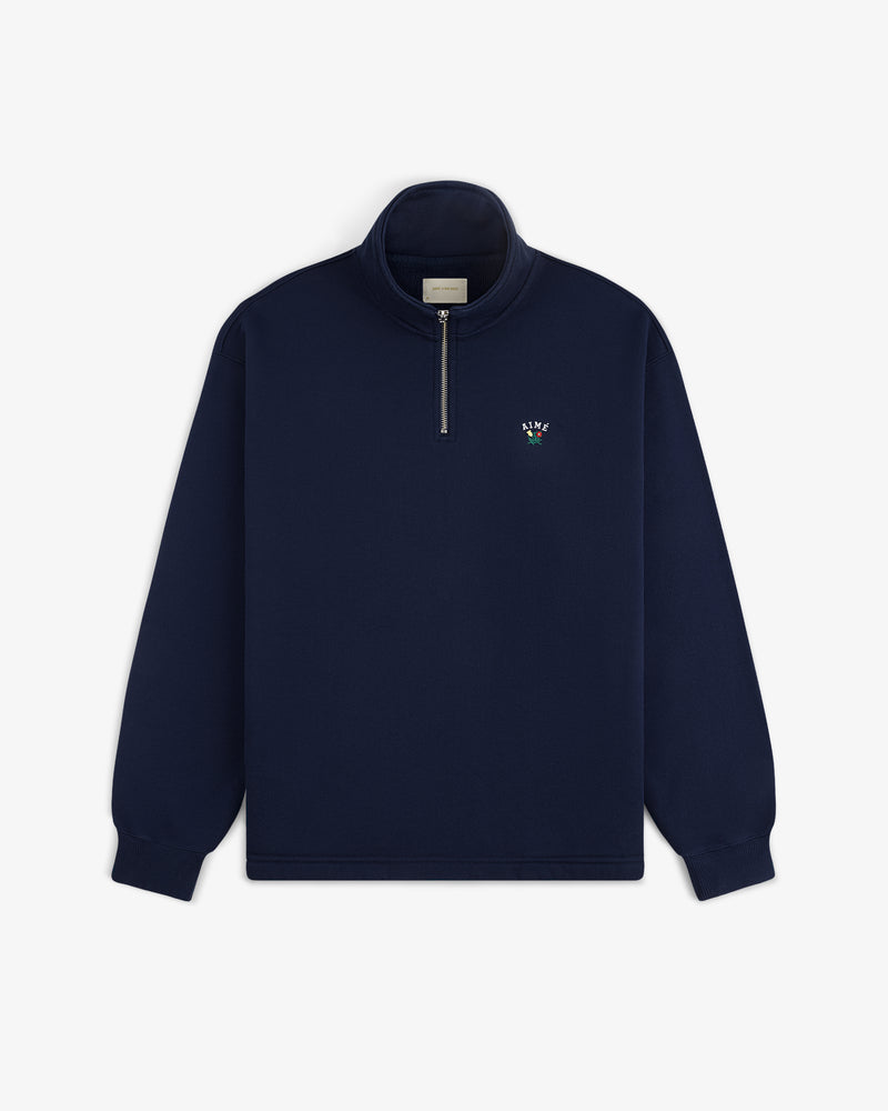 Crest Quarter Zip Pullover: Navy blue, long sleeves, left chest features a small embroidered logo.