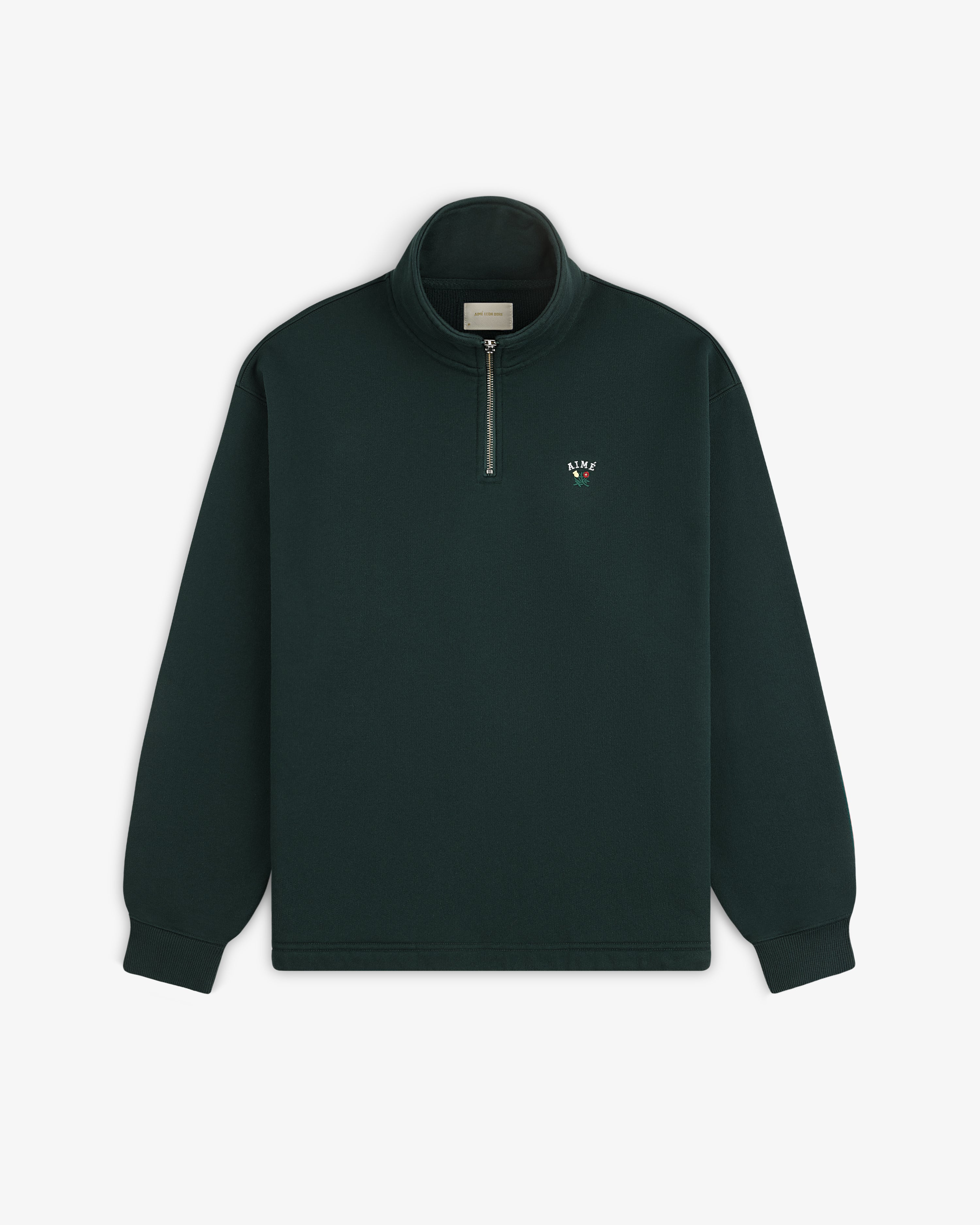 Crest Quarter Zip Pullover in dark green with stand-up collar and small embroidered logo on left chest.