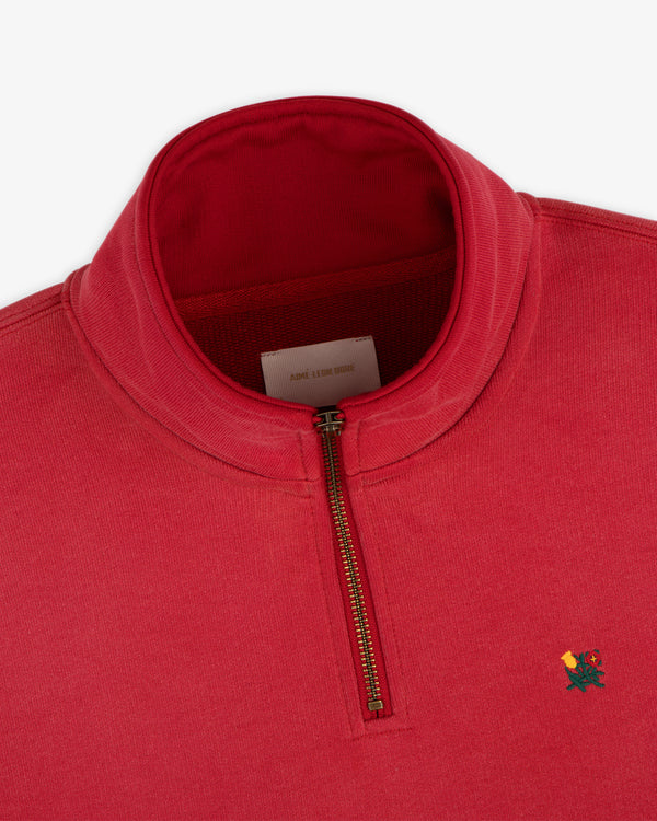 Sun Faded Crest Quarter Zip: red sweatshirt with gold zipper and small rose embroidery on the left chest.