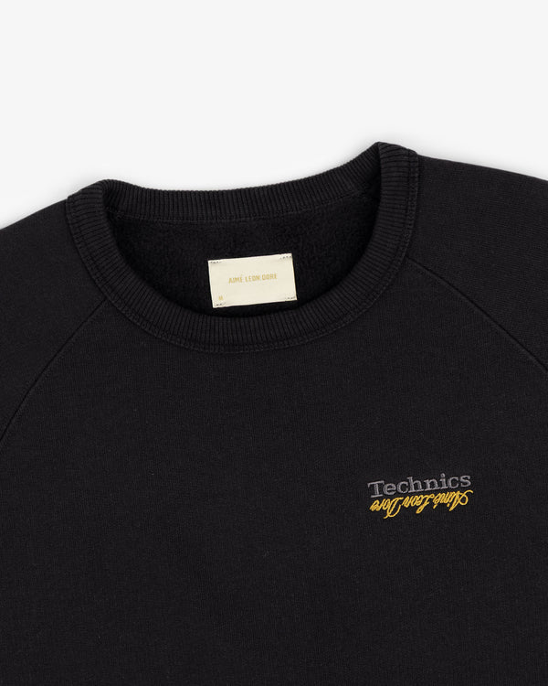 Black ALD / Technics World Champions Crewneck with yellow and white chest embroidery.