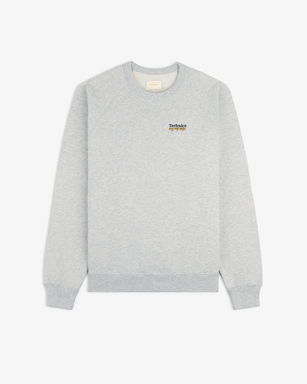 ALD / Technics World Champions Crewneck in light gray with small logo and turntable graphic on left chest.