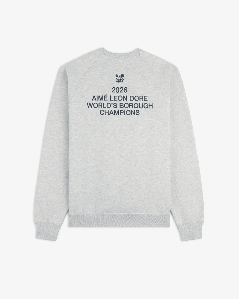 Light gray ALD / Technics World Champions Crewneck with 2026 Worlds Borough Champions text in navy on the back.