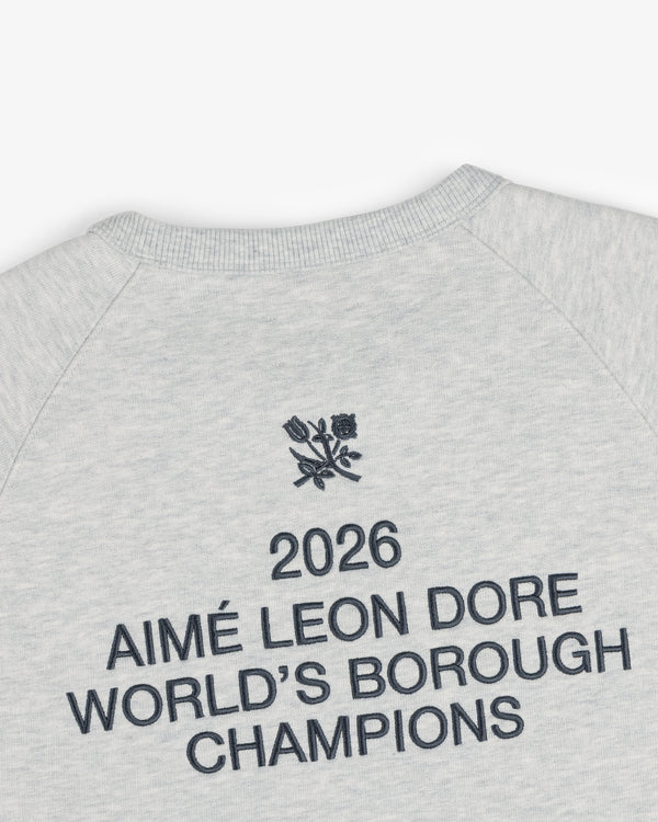 ALD / Technics World Champions Crewneck: Gray sweatshirt with black “2026 Aimé Leon Dore World’s Borough Champions” text and floral logo.