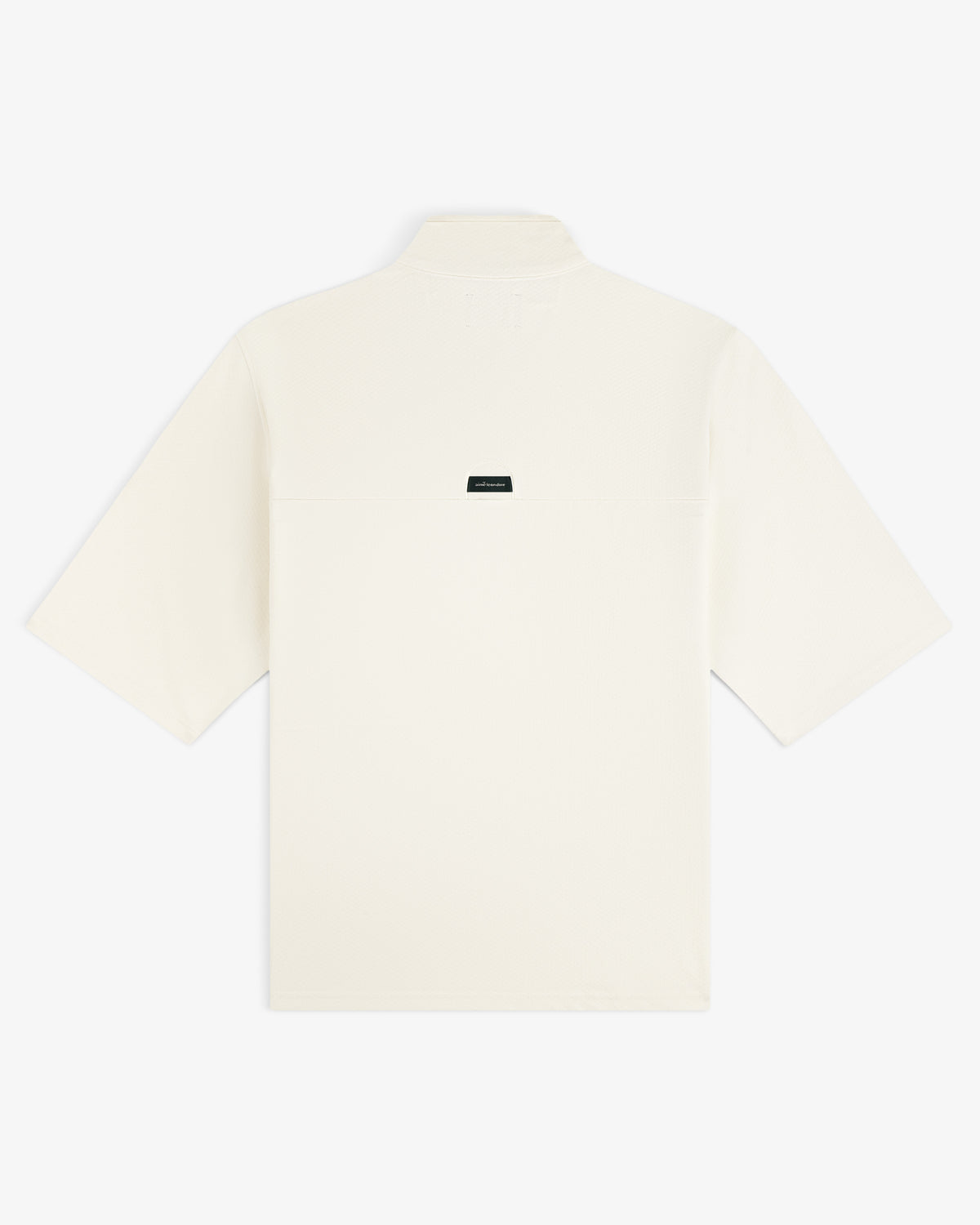 Back view of the ALD Golf Quarter Zip Pullover in off-white, featuring a small black rectangular label at the center.
