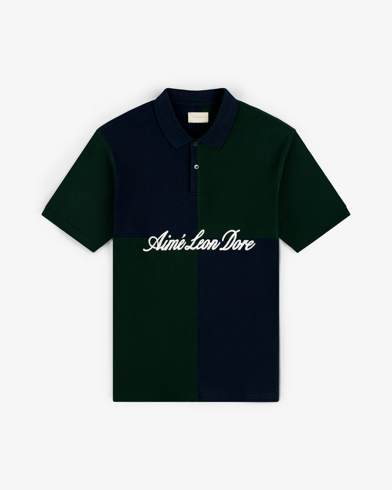 Color Blocked Pique Polo with dark green and navy blocks and "Aimé Leon Dore" script across the chest.
