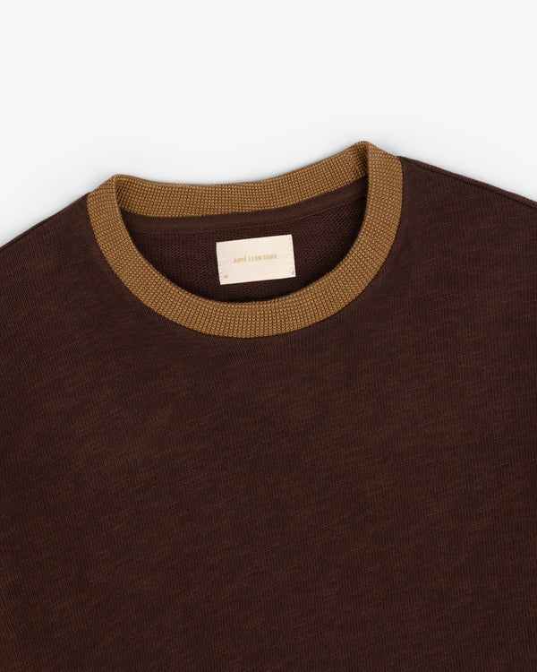 Brown Long-Sleeve Slub Football Tee with a ribbed tan collar, shown from above on a white background.