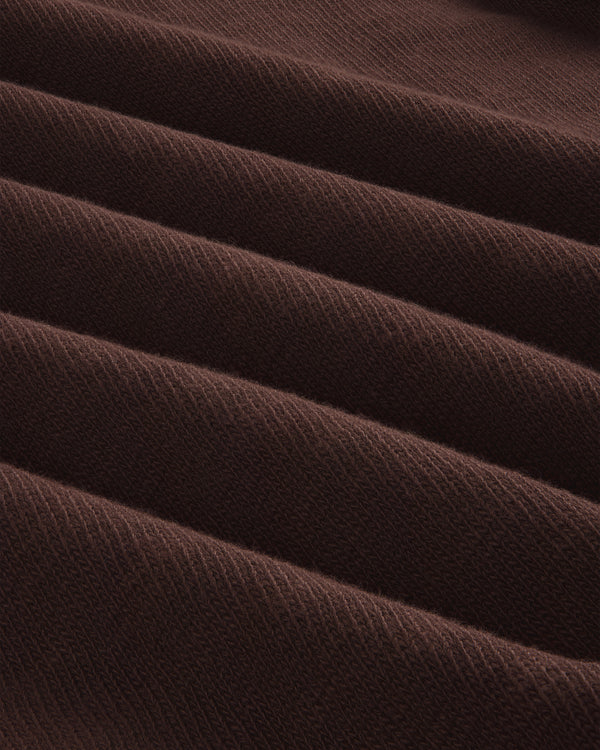 Close-up of folded, ribbed brown Long-Sleeve Slub Football Tee with a soft texture and diagonal lines.