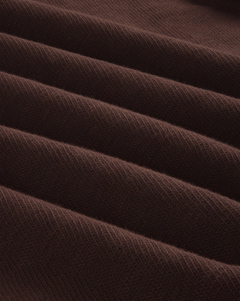 Close-up of folded, ribbed brown Long-Sleeve Slub Football Tee with a soft texture and diagonal lines.