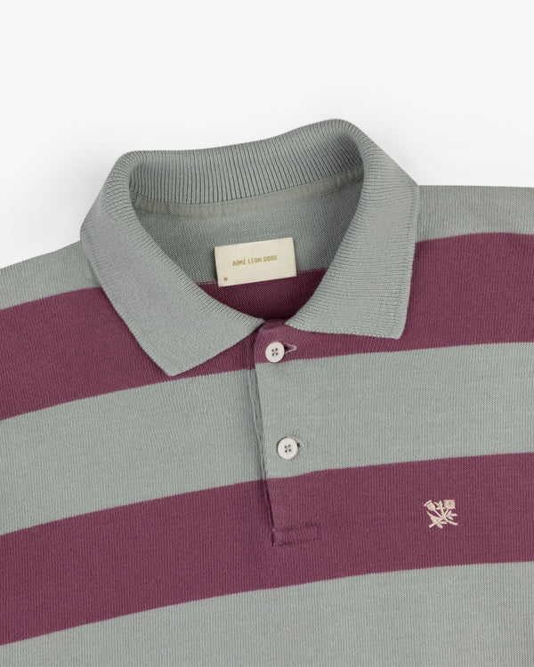 Striped Crest Rugby in gray and burgundy with a collar, buttons, and a small chest embroidered logo.