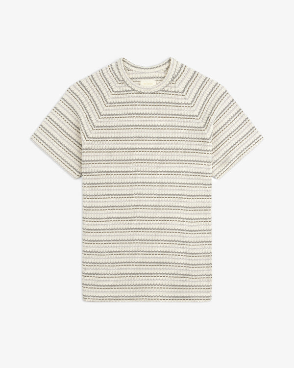 Jacquard Striped Tee in cream with short sleeves and textured black stripes, laid flat on a white background.