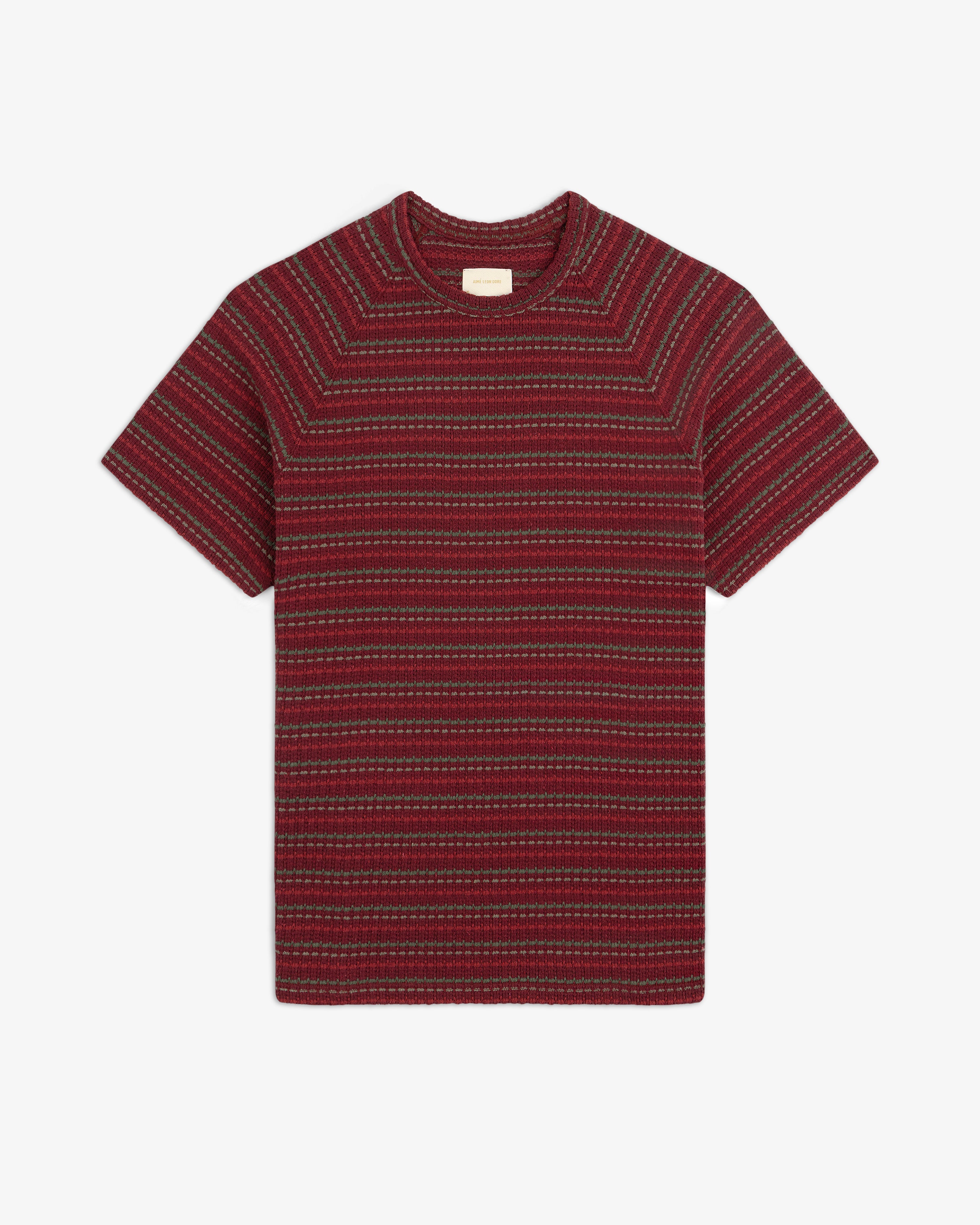 Jacquard Striped Tee with red and dark stripes, short sleeves, laid flat on a white background.
