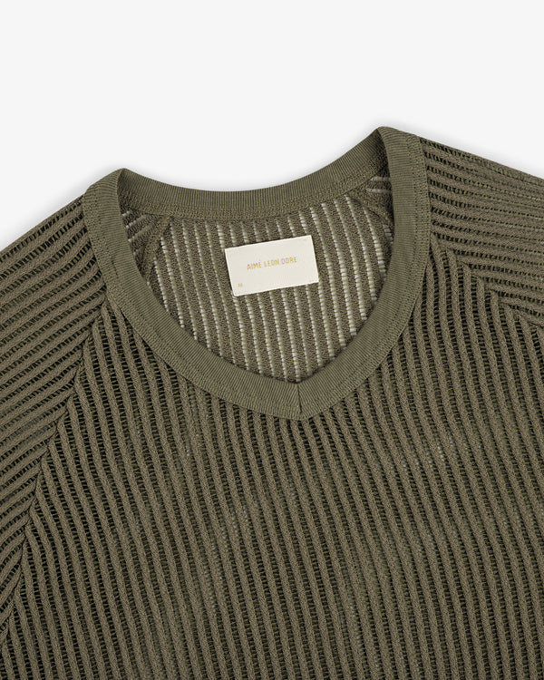 Mesh V-neck tee in olive green with a white ADAM LEON DORN label.
