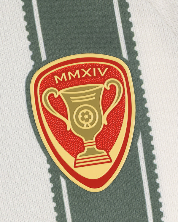A gold MMXIV trophy emblem on red, sewn onto white and green stripes of the Aimé Cup Soccer Jersey.