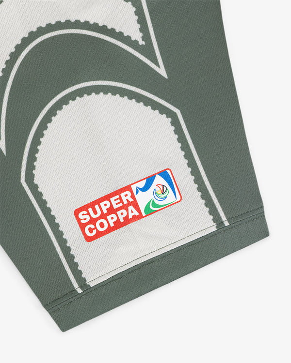 Close-up of the Aimé Cup Soccer Jersey’s green and white fabric with a colorful Super Coppa patch.