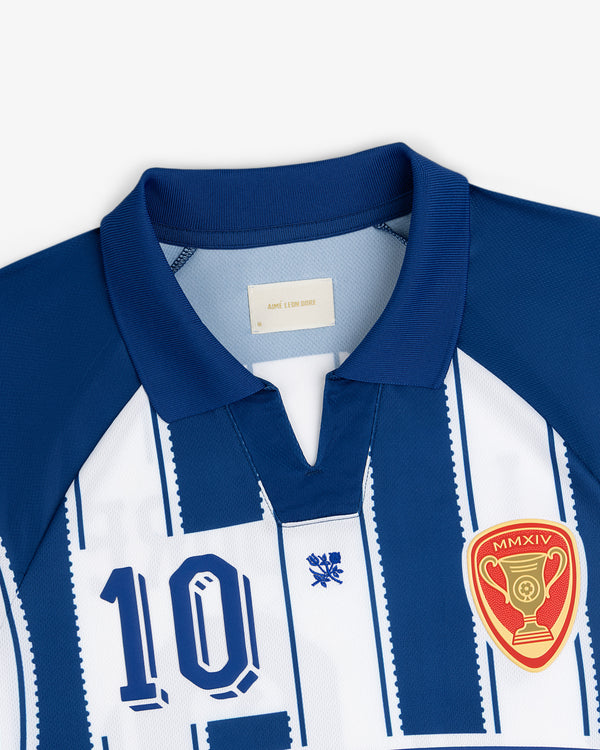 Aimé Cup Soccer Jersey: blue and white stripes, number 10, crest, and gold trophy patch on chest.