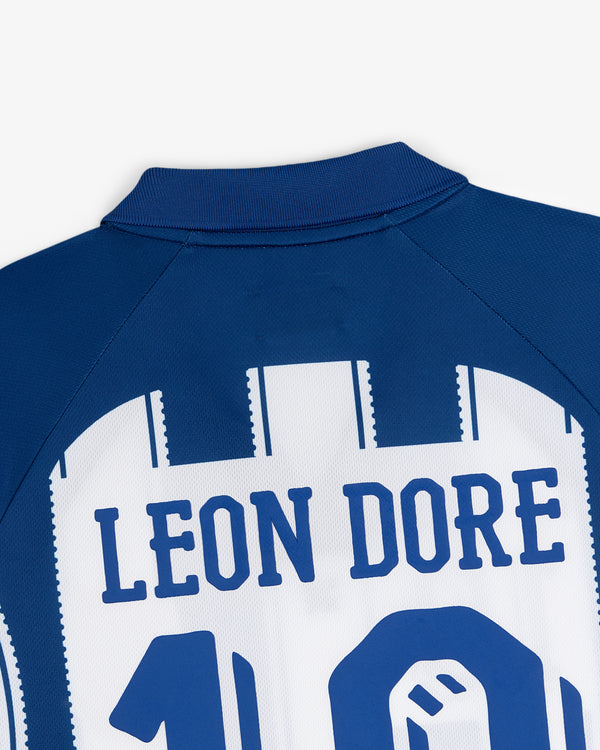 Close-up of a blue and white Aimé Cup Soccer Jersey with LEON DORE and the number 10 on the back.